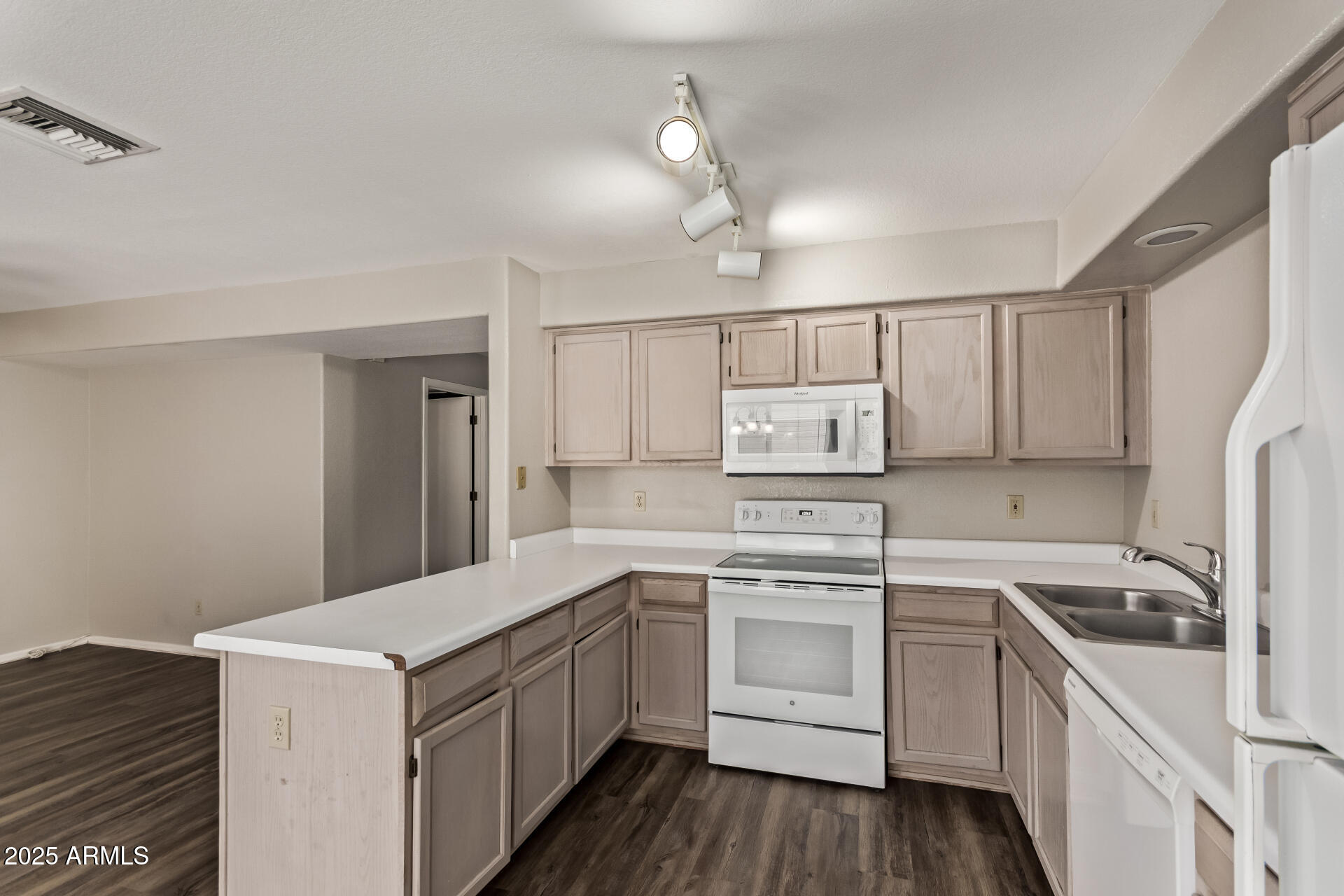 2875 West Highland Street, Unit 1112 Chandler, AZ 85224 - Photo 12 of 33 a kitchen with a sink a stove a refrigerator and white cabinets
