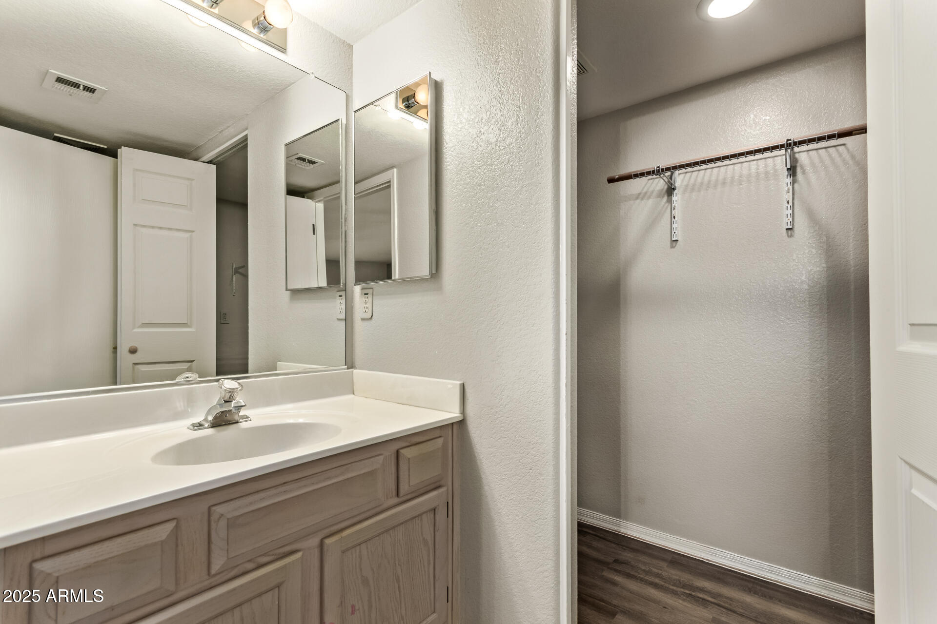 2875 West Highland Street, Unit 1112 Chandler, AZ 85224 - Photo 14 of 33 a bathroom with a sink and a mirror