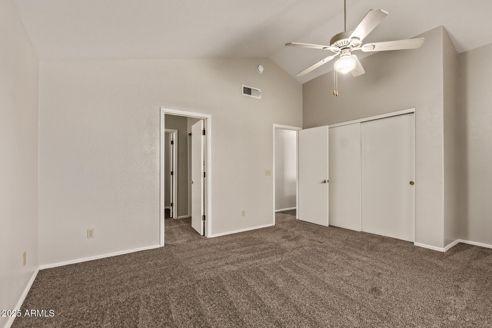 2875 West Highland Street, Unit 1112 Chandler, AZ 85224 - Photo 17 of 33 a view of an empty room with a ceiling fan