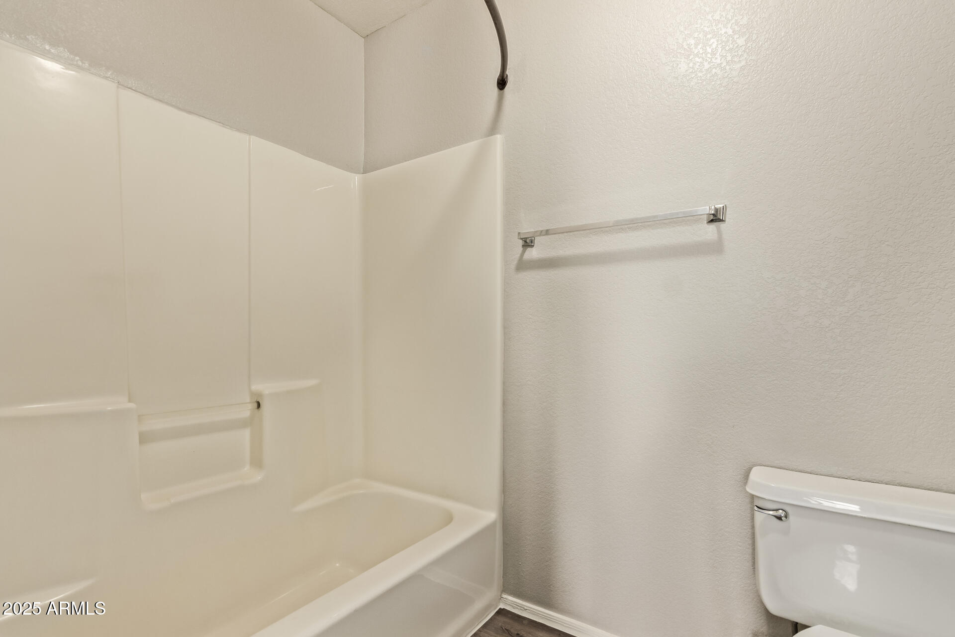 2875 West Highland Street, Unit 1112 Chandler, AZ 85224 - Photo 19 of 33 a white bath tub sitting next to a white toilet and a shower
