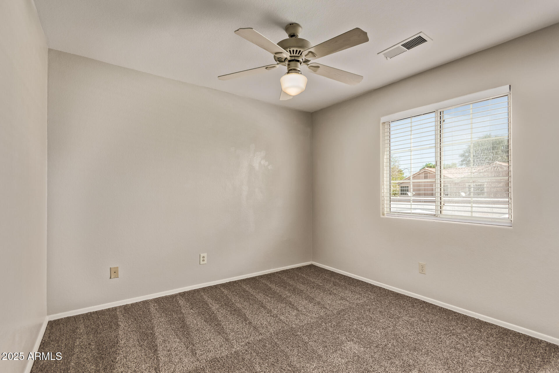 2875 West Highland Street, Unit 1112 Chandler, AZ 85224 - Photo 22 of 33 an empty room with a window