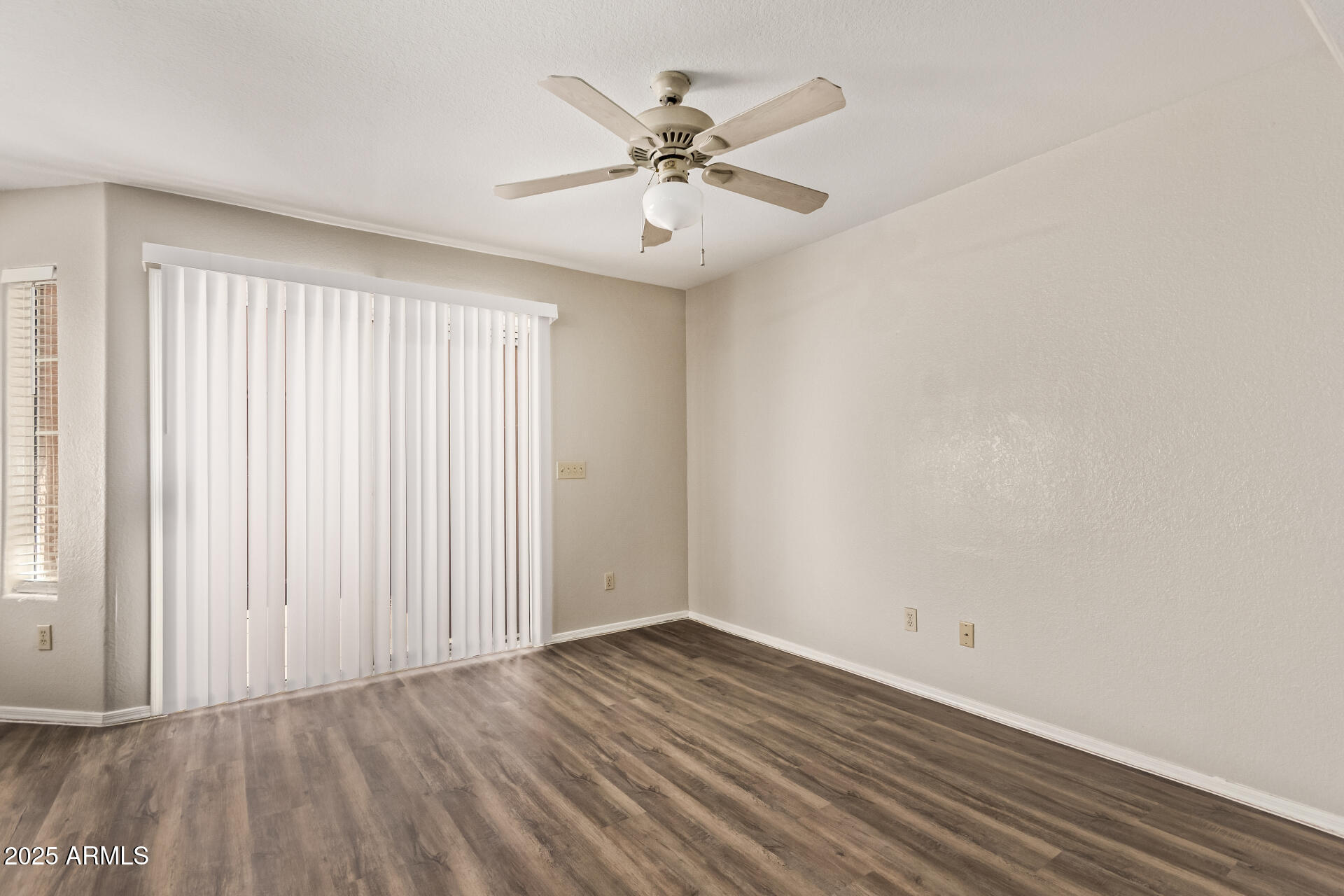 2875 West Highland Street, Unit 1112 Chandler, AZ 85224 - Photo 8 of 33 wooden floor in an empty room with a window