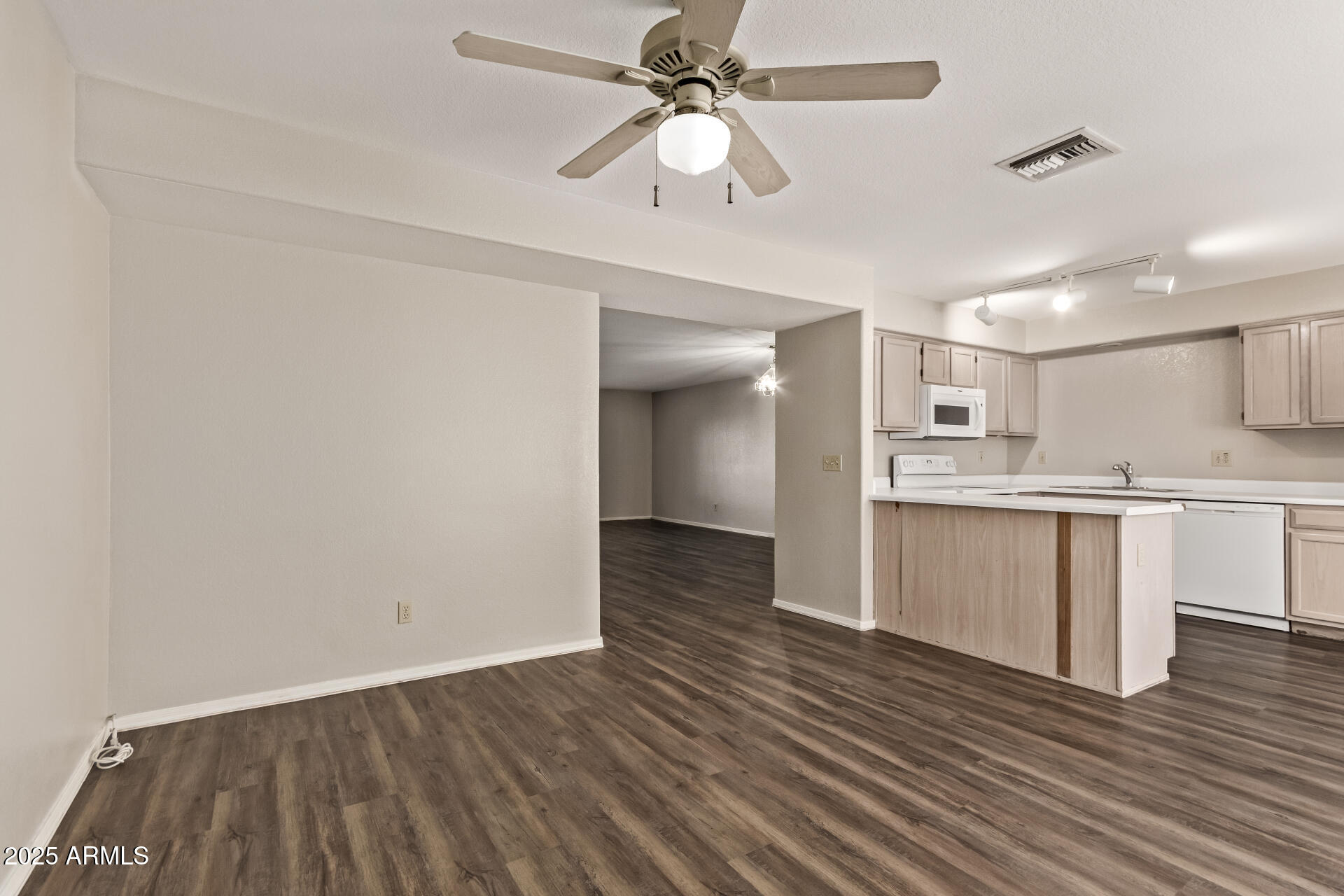 2875 West Highland Street, Unit 1112 Chandler, AZ 85224 - Photo 9 of 33 a view of kitchen with granite countertop cabinets and wooden floor