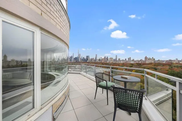 a bathroom with a tub a sink and a mirror
