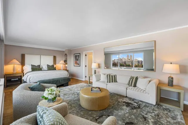 a large kitchen with stainless steel appliances a stove a sink and a microwave