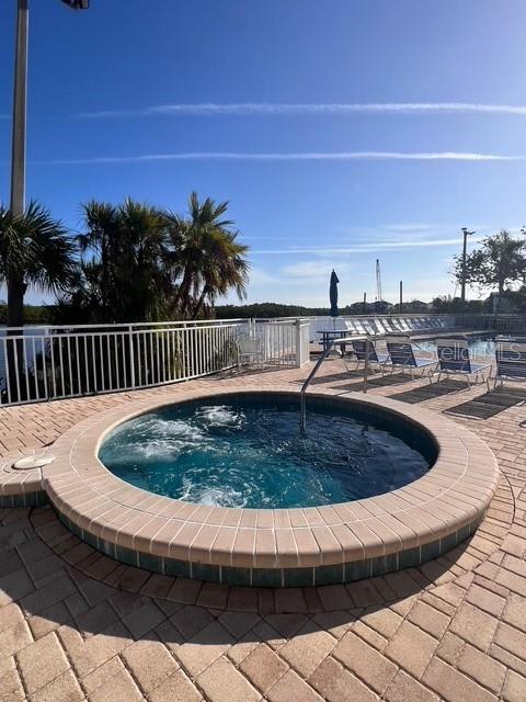611 Destiny Drive, Unit 115 Ruskin, FL 33570 - Photo 15 of 28 a view of swimming pool with outdoor seating