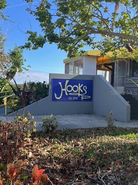 611 Destiny Drive, Unit 115 Ruskin, FL 33570 - Photo 18 of 28 a view of outdoor space with sign board and tree