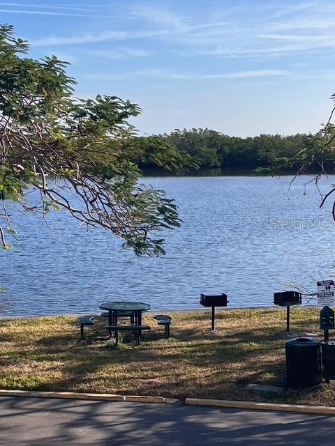 611 Destiny Drive, Unit 115 Ruskin, FL 33570 - Photo 21 of 28 a view of a brick house with a yard