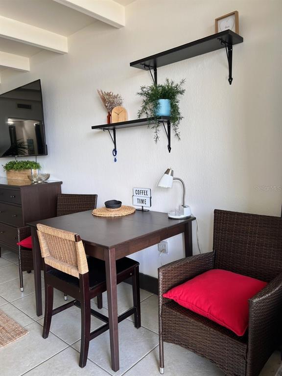 611 Destiny Drive, Unit 115 Ruskin, FL 33570 - Photo 6 of 28 a view of a dining room with furniture