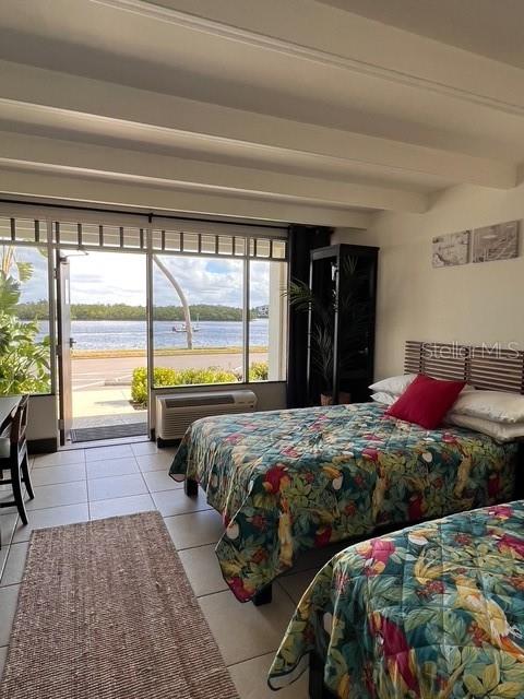 611 Destiny Drive, Unit 115 Ruskin, FL 33570 - Photo 8 of 28 a bedroom with a large bed and a large window