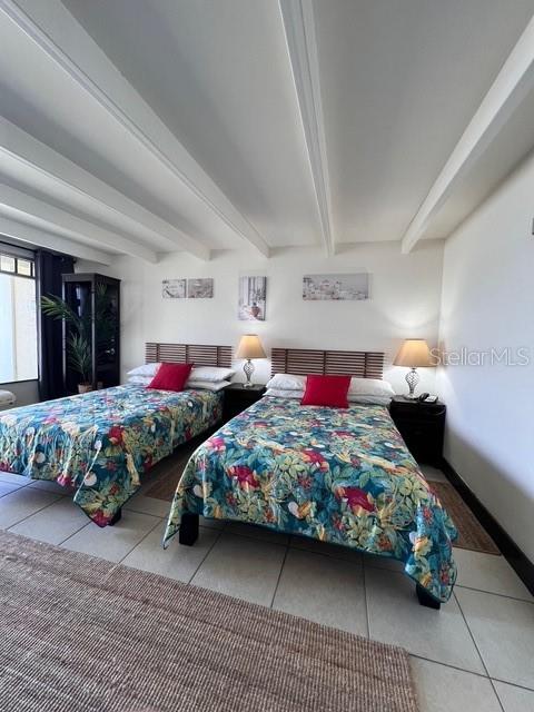 611 Destiny Drive, Unit 115 Ruskin, FL 33570 - Photo 9 of 28 a bedroom with two beds and a couch