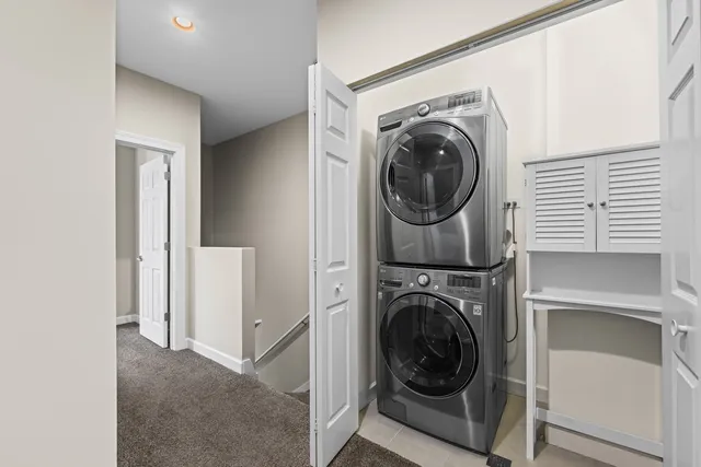 a view of a hallway with washer and dryer