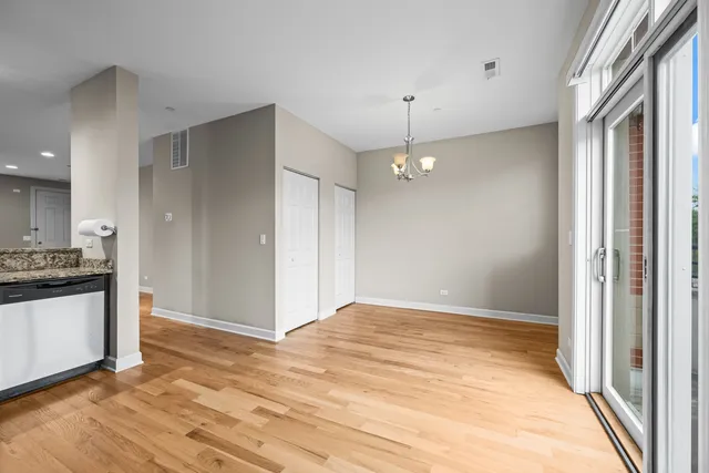 a view of a kitchen from the hallway