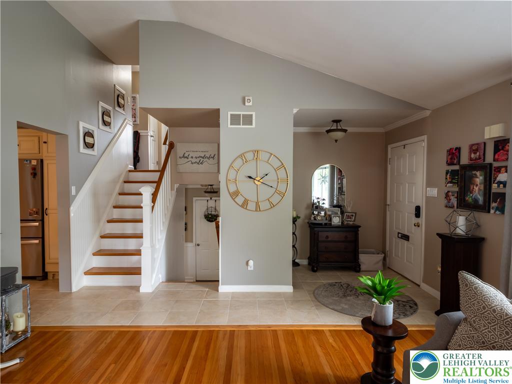2087 Hopewell Road Bethlehem, PA 18017 - Photo 6 of 38 Hardwood and tile flooring unite, leading to an inviting staircase in this airy entryway.