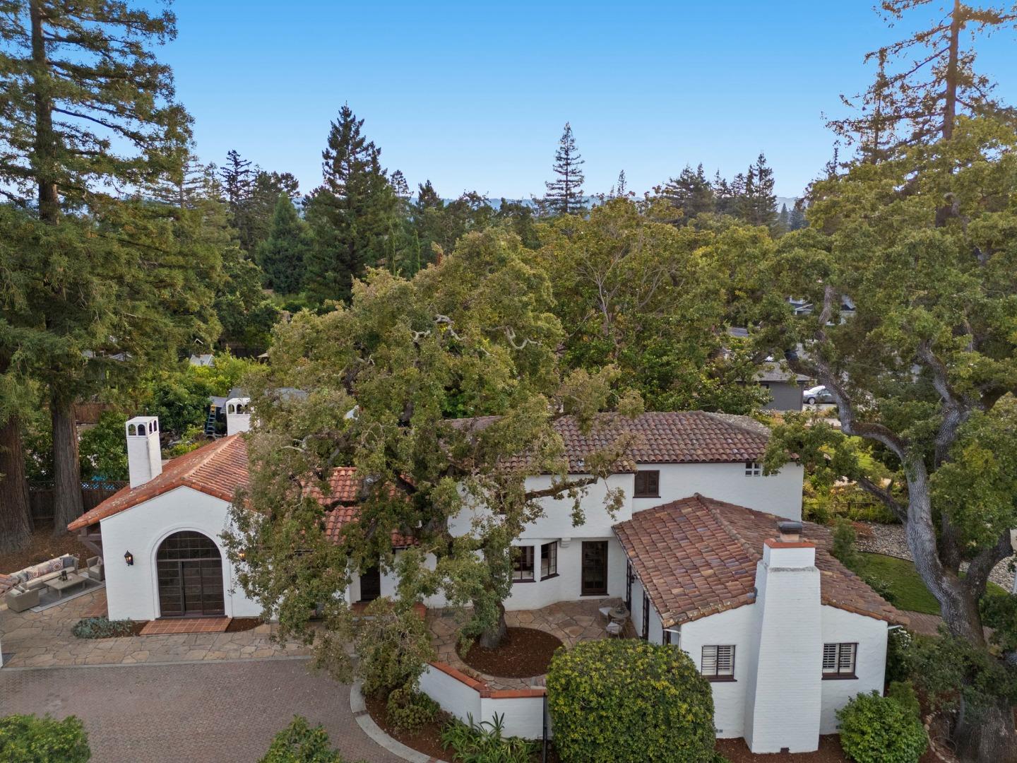 a aerial view of a house with a yard and garage