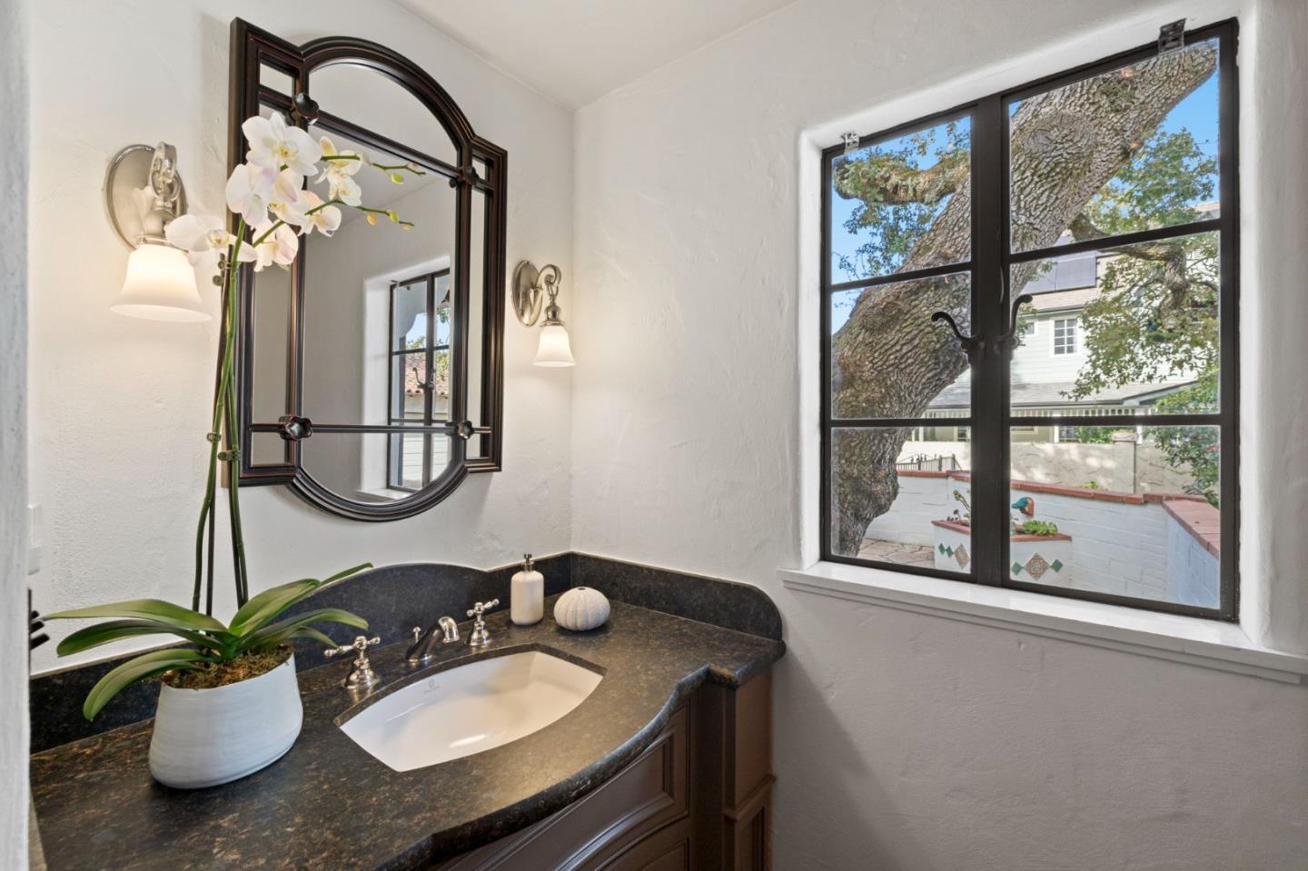 503 Arlington Road Redwood City, CA 94062 - Photo 21 of 48 a bathroom with a granite countertop sink and a mirror