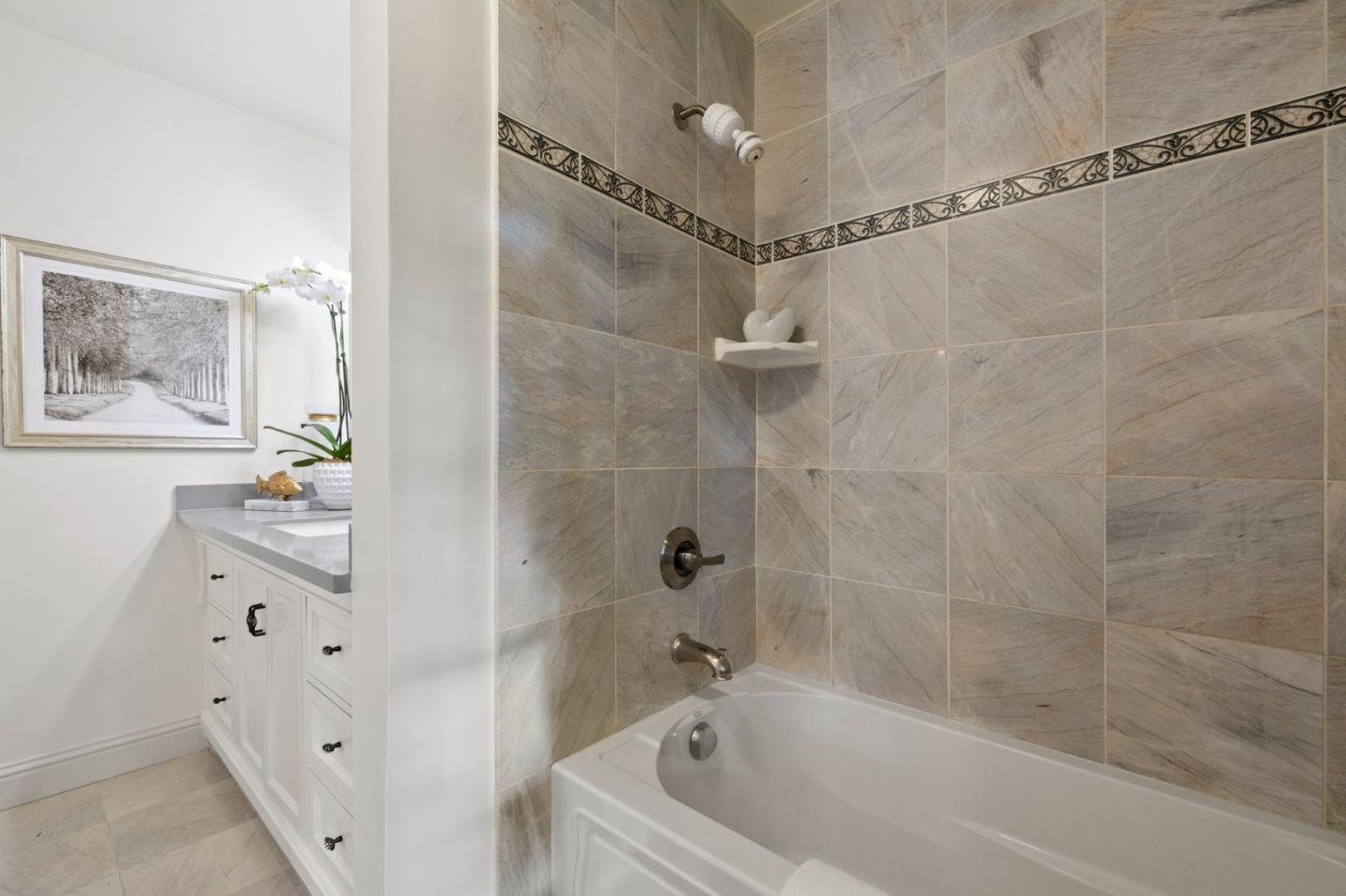 503 Arlington Road Redwood City, CA 94062 - Photo 26 of 48 a bathroom with a bathtub and a shower