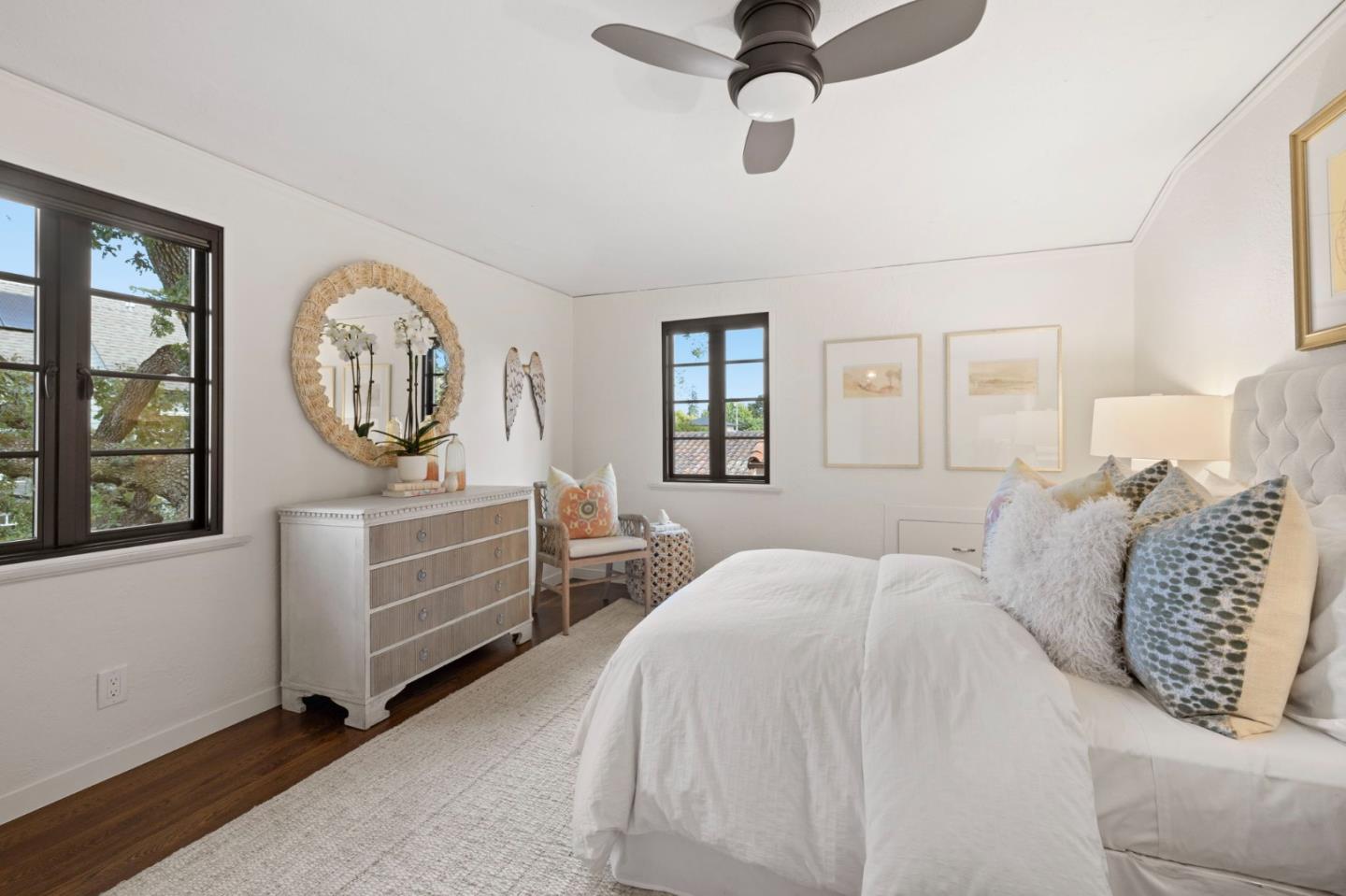 503 Arlington Road Redwood City, CA 94062 - Photo 30 of 48 a bedroom with a large bed and a chandelier