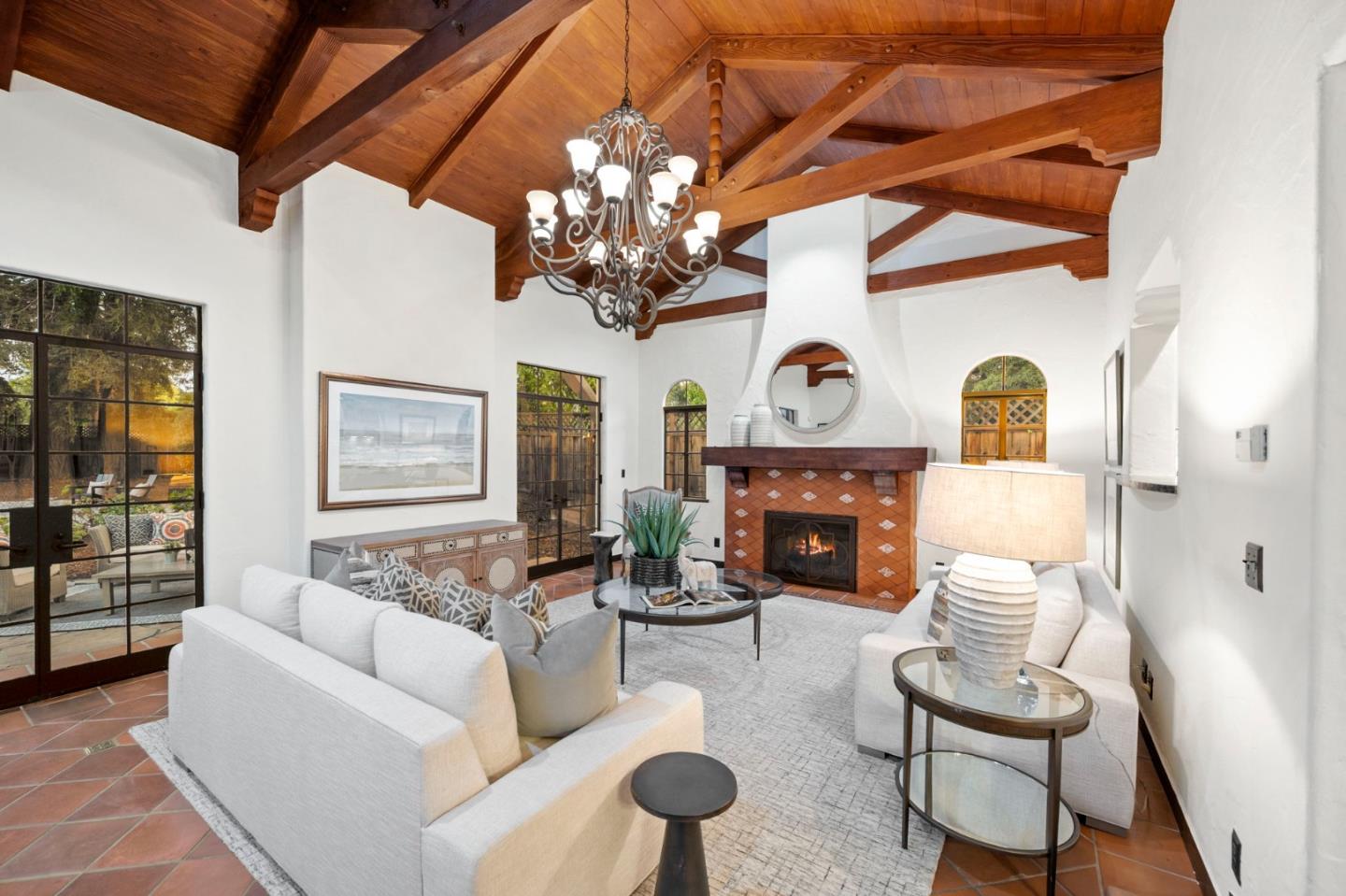 503 Arlington Road Redwood City, CA 94062 - Photo 33 of 48 a living room with furniture a fireplace and a chandelier