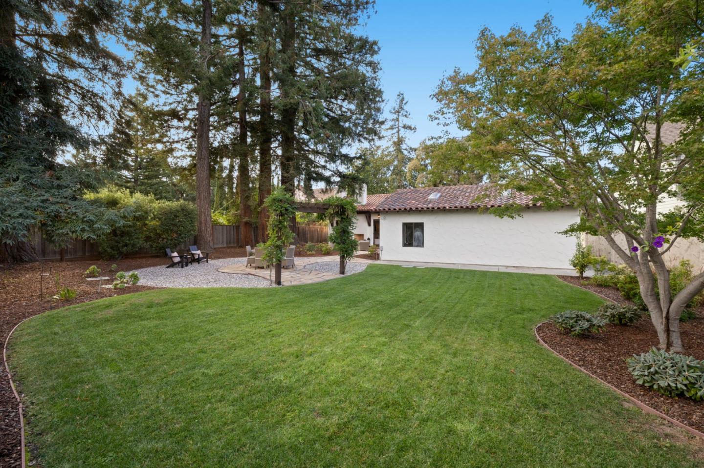 503 Arlington Road Redwood City, CA 94062 - Photo 40 of 48 a view of a backyard with a garden and trees