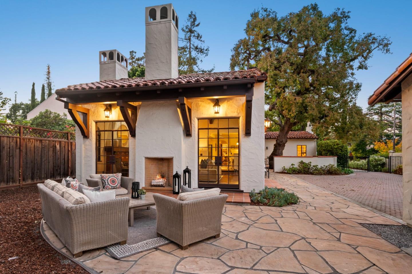 503 Arlington Road Redwood City, CA 94062 - Photo 44 of 48 a view of a couches and a fire pit in the patio in front of a house