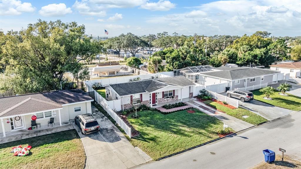 4626 Abdella Lane Holiday, FL 34690 - Photo 2 of 34 an aerial view of a house with swimming pool and large trees