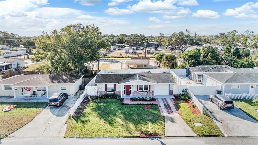 4626 Abdella Lane Holiday, FL 34690 - Photo 3 of 34 an aerial view of a house with a garden