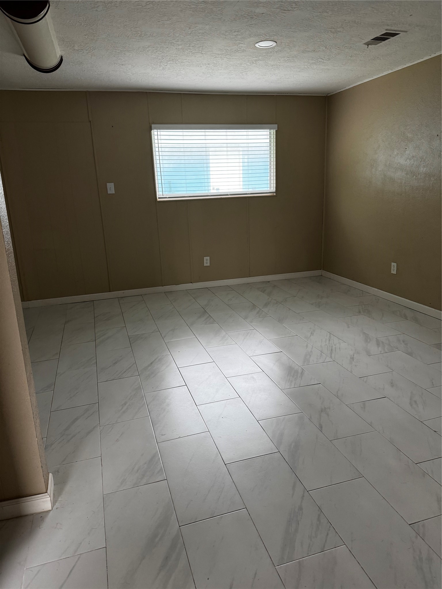 4515 7th Street Bacliff, TX 77518 - Photo 8 of 15 a view of an empty room with a window