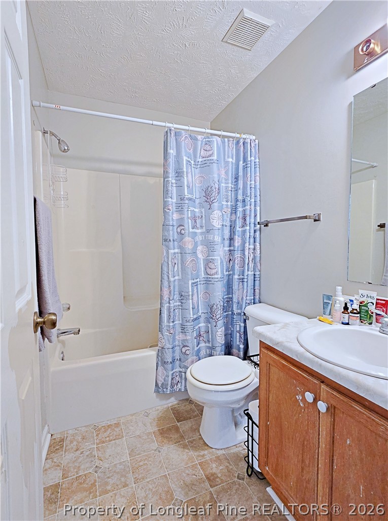5218 Pringle Way Hope Mills, NC 28348 - Photo 29 of 43 a bathroom with a sink toilet and shower