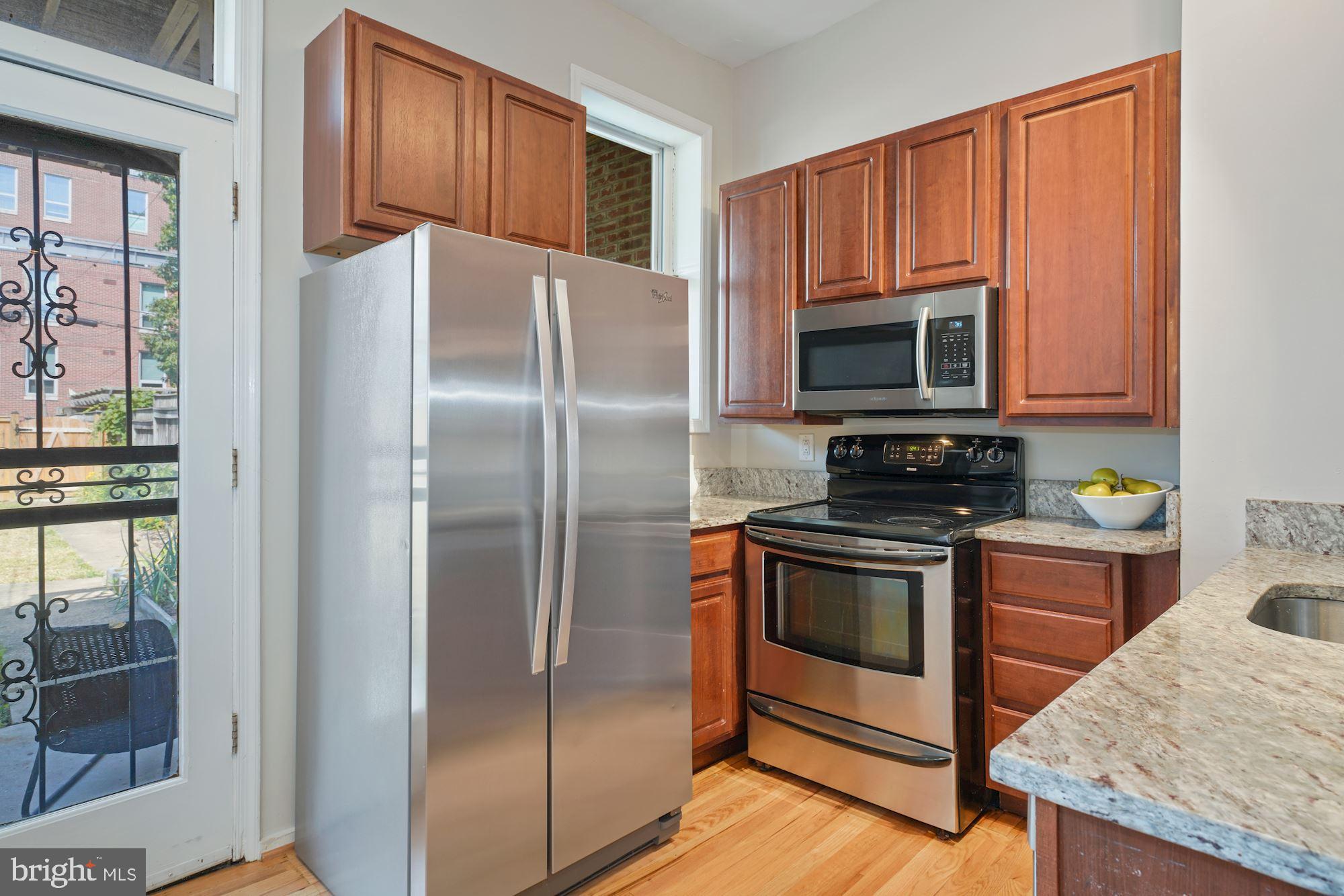 716 3rd Street Northeast Washington, DC 20002 - Photo 10 of 27 The Kitchen Flows To The Rear Garden & Parking