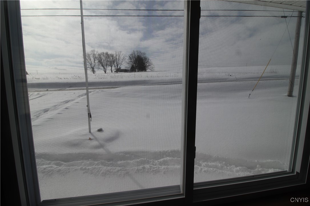 6932 Guyder Road Lysander, NY 13112 - Photo 14 of 23 Living Room View with No Neighbors in Sight