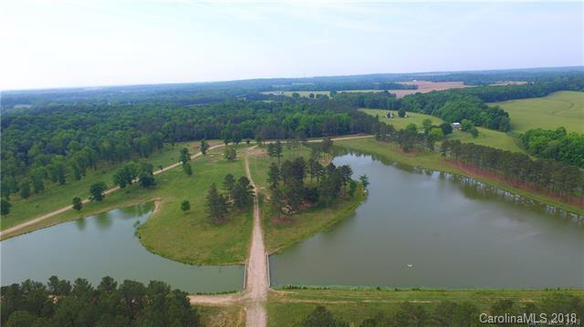 508 Macedonia Church Road, Unit 1 Monroe, NC 28112 - Photo 6 of 8 an aerial view of residential houses with outdoor space and lake view