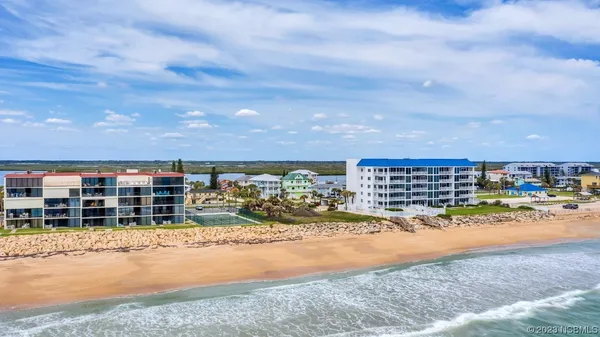 a living room with furniture a chandelier and a window