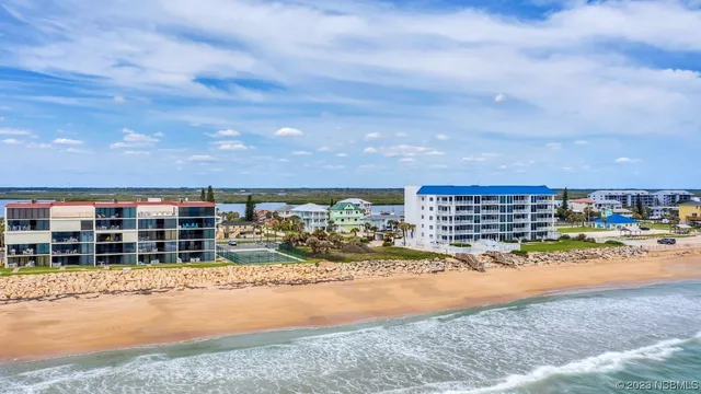 a living room with furniture a chandelier and a window