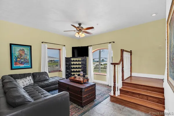 a dining room with furniture window and outside view