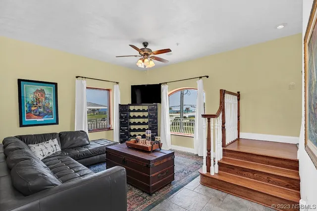 a dining room with furniture window and outside view