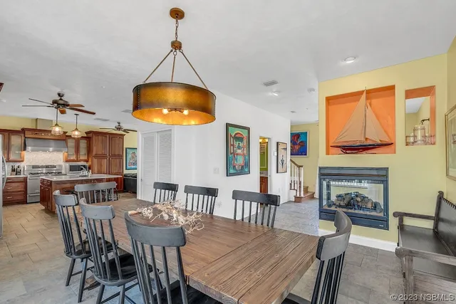 a bedroom with a bed a window and a flat screen tv