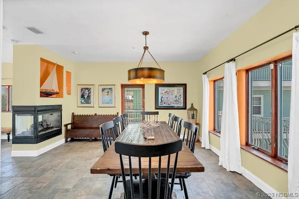 a bathroom with a granite countertop toilet a sink and a mirror