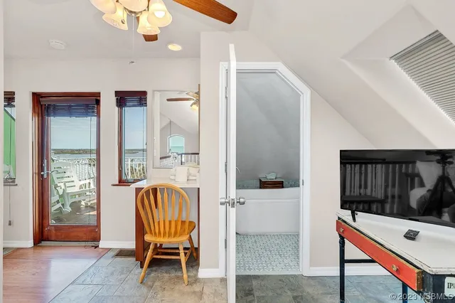 a kitchen with stainless steel appliances a refrigerator sink and cabinets