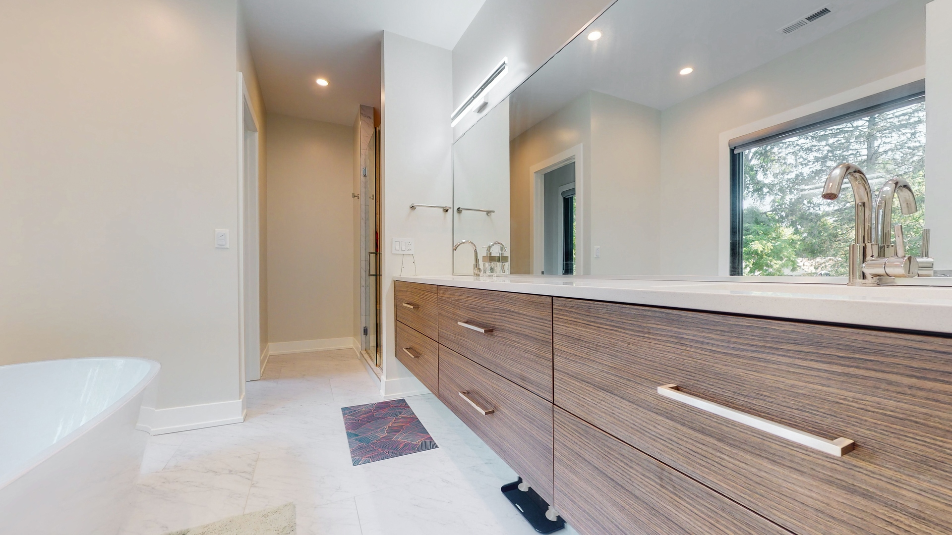 1 A Half Day Road Lincolnshire, IL 60069 - Photo 15 of 37 a bathroom with a double vanity sink and a large mirror