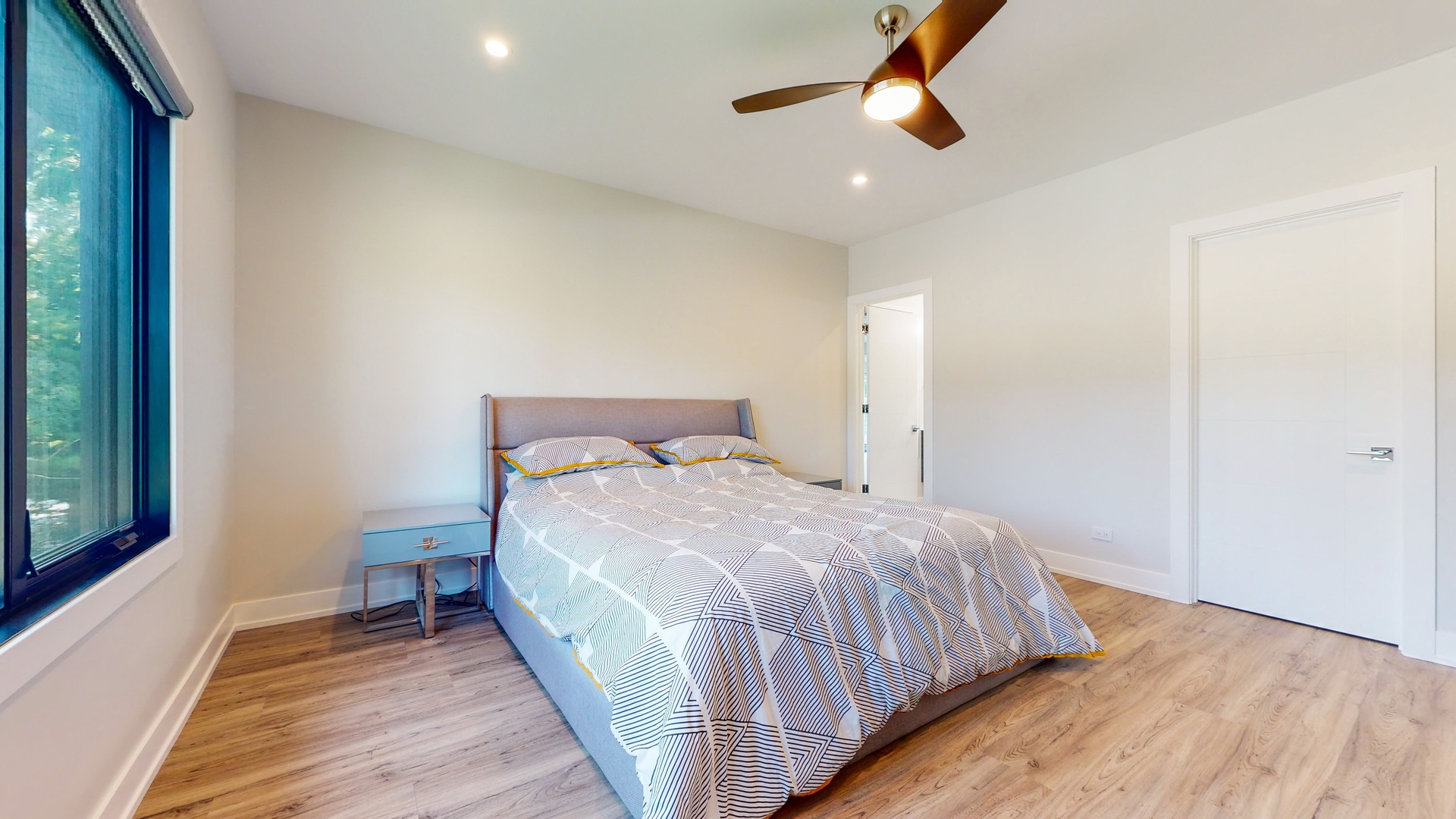 1 A Half Day Road Lincolnshire, IL 60069 - Photo 19 of 37 a bedroom with a bed and wooden floor