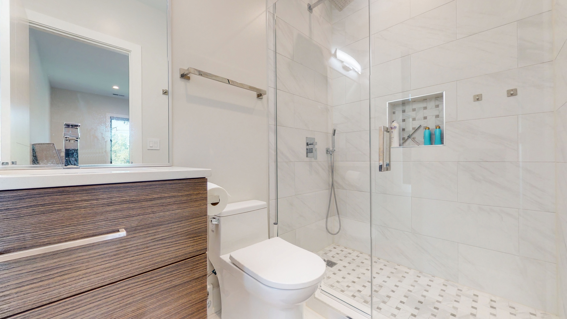 1 A Half Day Road Lincolnshire, IL 60069 - Photo 20 of 37 a bathroom with a granite countertop toilet sink and shower