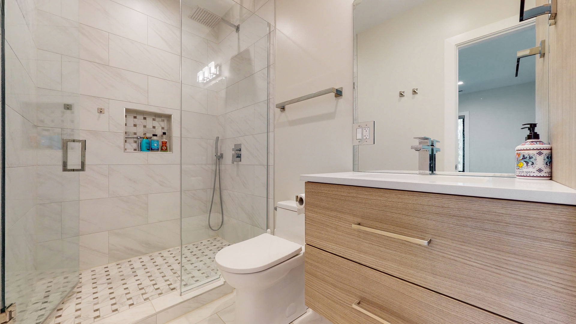 1 A Half Day Road Lincolnshire, IL 60069 - Photo 22 of 37 a bathroom with a sink a toilet and shower