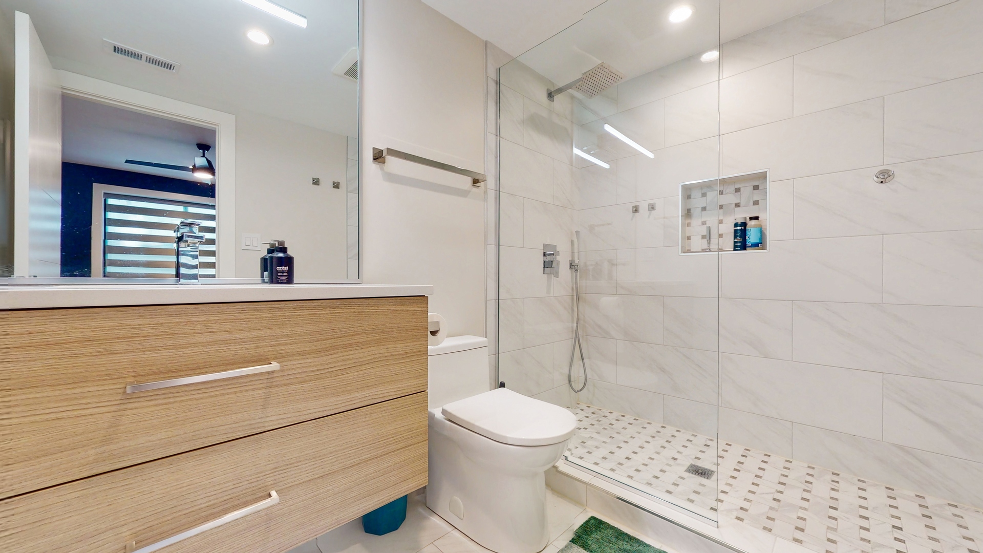 1 A Half Day Road Lincolnshire, IL 60069 - Photo 29 of 37 a bathroom with a sink a toilet and shower