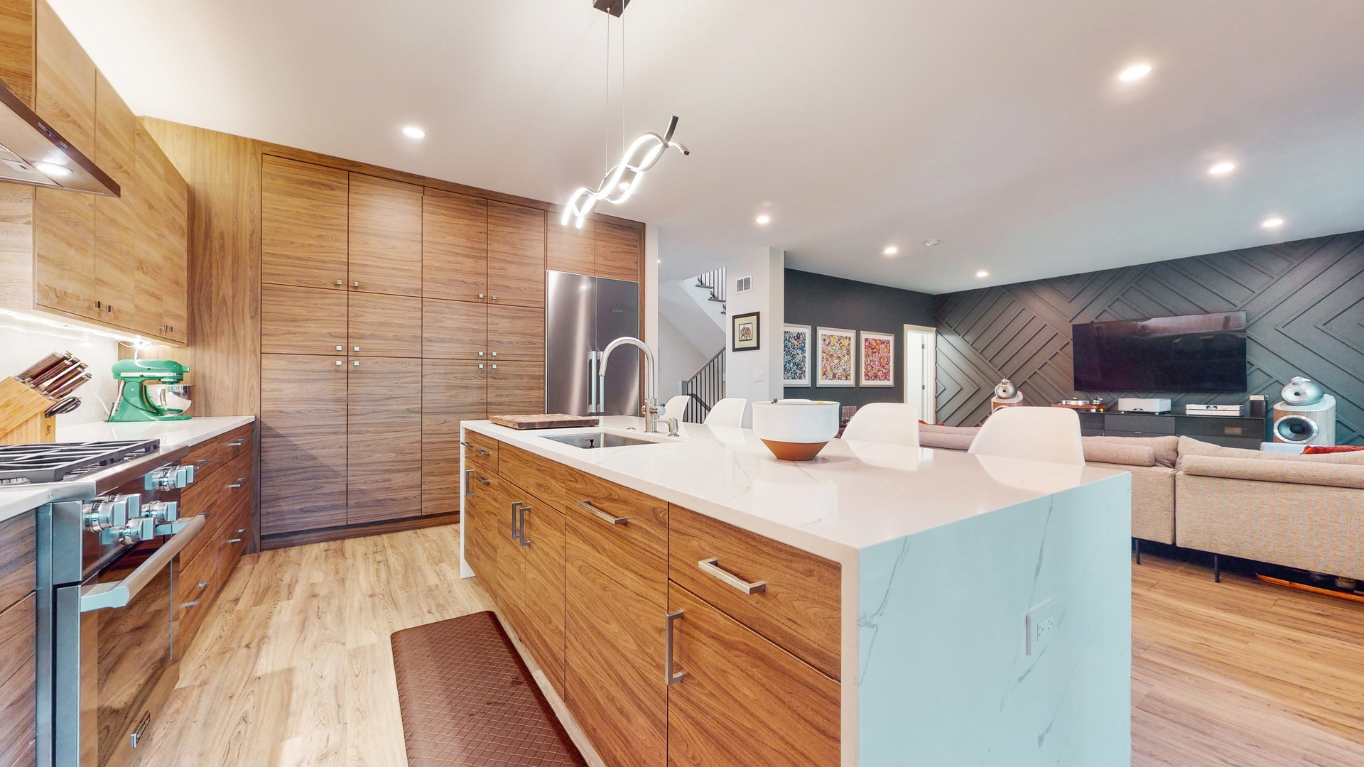 1 A Half Day Road Lincolnshire, IL 60069 - Photo 8 of 37 a kitchen with stainless steel appliances kitchen island granite countertop a sink a stove top oven a counter space and cabinets