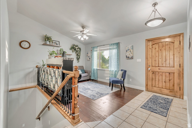 356 North 230 West Payson, UT 84651 - Photo 4 of 45 Entryway featuring a solid wood panel door, tiled flooring, and a contemporary ceiling light fixture
