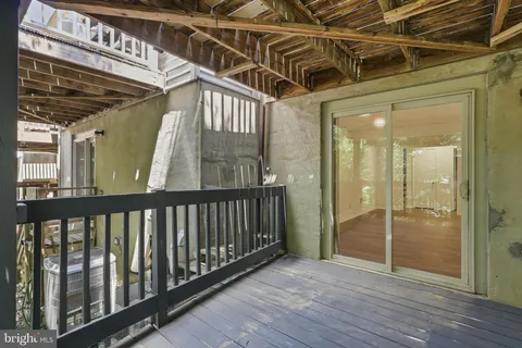 a view of a porch with wooden floor