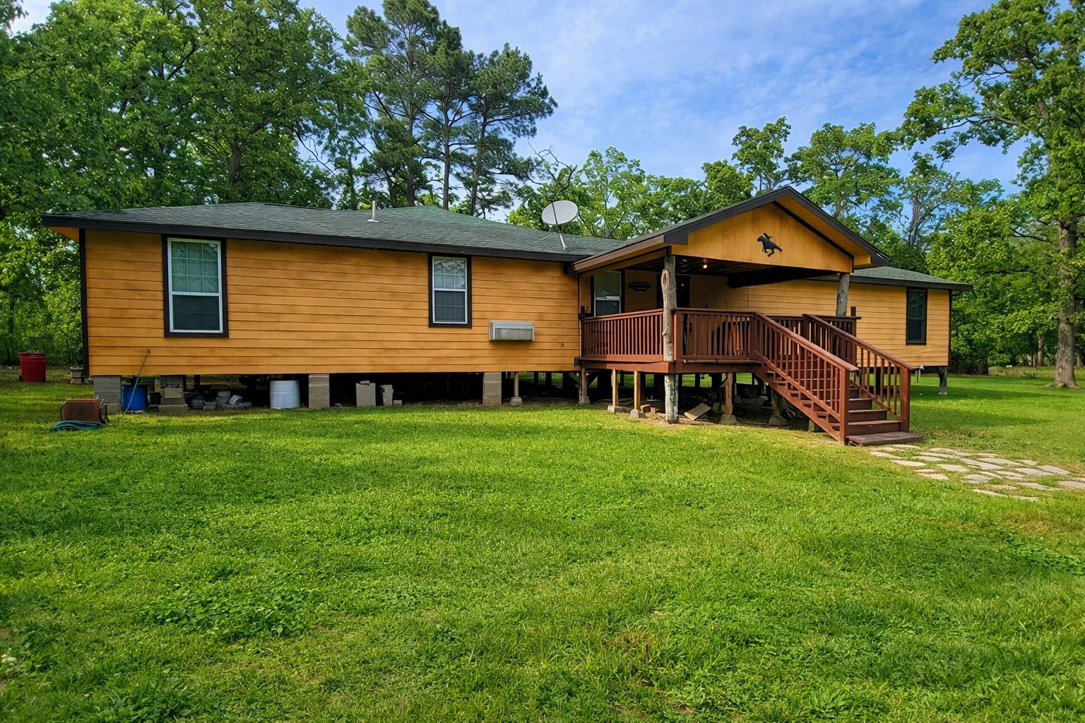 157 Oates Brothers Road Trinity, TX 75862 - Photo 5 of 10 a front view of a house with a yard