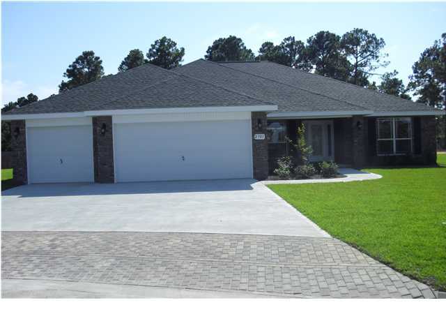 9685 Misty Meadow Lane Navarre, FL 32566 - Photo 1 of 18 a front view of house with yard