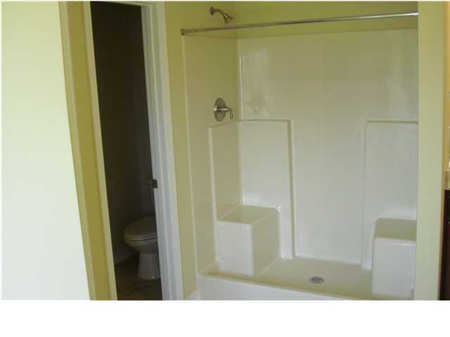 9685 Misty Meadow Lane Navarre, FL 32566 - Photo 13 of 18 a bathroom with a shower and a sink